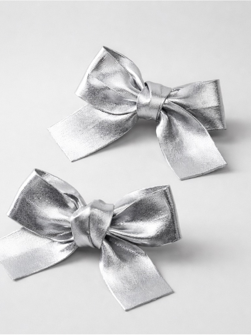 2 Silver Metallic Faux Leather Bow Hair Clips